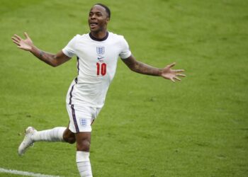 PENYERANG England, Raheem Sterling meraikan jaringannya ketika membantu England menang ke atas Jerman dalam aksi suku akhir di Stadium Wembley, London, 29 Jun lalu.- AFP