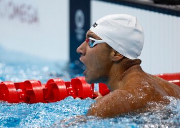 Ahmed Hafnaoui perenang remaja Tunisia melakar kejutan dengan meraih pingat emas dalam acara renang 400m gaya bebas.