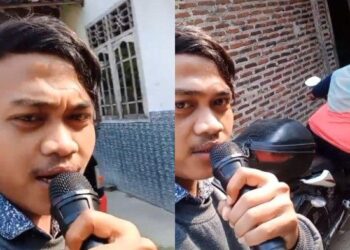 TANGKAP layar video menunjukkan Adli Nawari menggunakan mikrofon dan alat pembesar suara ketika meminta seorang ahli koperasi membayar ansuran pinjaman. - AGENSI