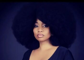 AEVIN Dugas kini memiliki rambut afro terbesar di dunia. - AGENSI  