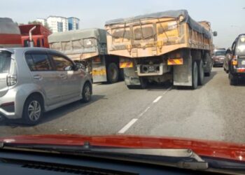 Tindakan pemandu lori memotong sesuka hati menambah lagi kesesakan jalan raya sedia ada.