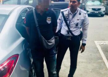 ANTARA individu yang diberkas dalam operasi khas penjaga parkir haram di sekitar bandar raya Ipoh sejak semalam. - UTUSAN/IHSAN PDRM