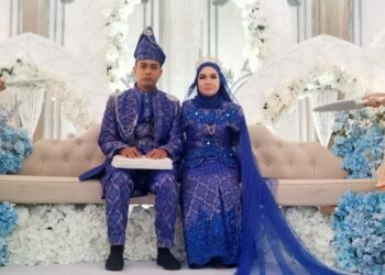 NORFARRAH Syahirah Shaari dan Zulfadli Syahrul melangsungkan pernikahan di Masjid Al-Maaruf Parit 5 Sungai Sumun,  Hutan Melintang di Bagan Datuk hari ini. - UTUSAN/AIN SAFRE BIDIN