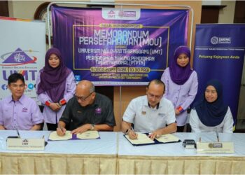 MAJLIS menandatangani perjanjian persefahaman antara UMT dan PTPTN.