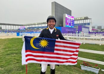 Mohd. Qabil Ambak Mahamad Fathil berjaya menyumbang emas kedua buat Kontinjen Malaysia di Sukan Asia selepas mendominasi acara dressage individu, semalam.-IHSAN MOM