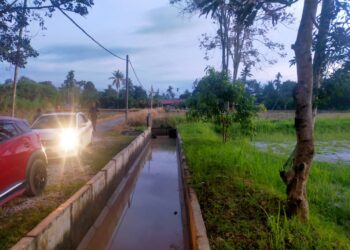 LOKASI kejadian seorang kanak-kanak lelaki yang ditemukan lemas ketika bermain di tali air bersebelahan sawah di Kampung Pantai Cicar, Kuala Ketil di Baling. -IHSAN POLIS