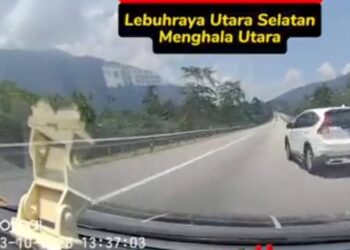 TANGKAP layar video tular sebuah kereta jenis Honda CRV yang dipandu secara melulu dan berbahaya di Kilometer 318, Lebuh Raya Utara-Selatan arah utara dekat Tapah. - UTUSAN