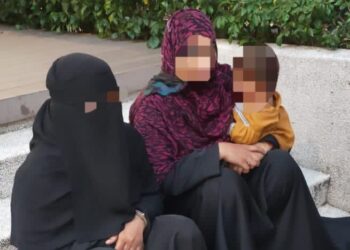 ANTARA wanita warga asing memakai niqab dan kanak-kanak yang ditahan ketika mengemis di sekitar ibu kota hari ini.