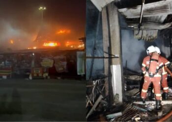 ANGGOTA bomba memadamkan kebakaran yang berlaku di gerai makan di hadapan Dataran Telok Kemang, Port Dickson malam tadi.
