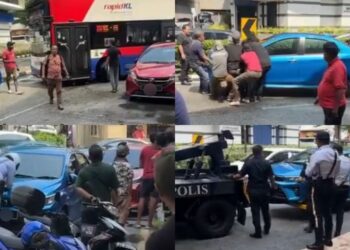 KERETA Perodua Bezza biru yang diangkat orang ramai sebelum ditarik trak tunda pihak polis di Jalan Ampang, Kuala Lumpur.