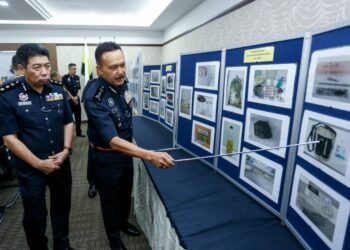 MOHD. Yusri Hassan Basri menunjukkan gambar rampasan dadah dan tangkapan dalam Operasi Op Tapis Khas pada sidang akhbar di IPK Perak di Ipoh. - UTUSAN/MUHAMAD NAZREEN SYAH MUSTHAFA