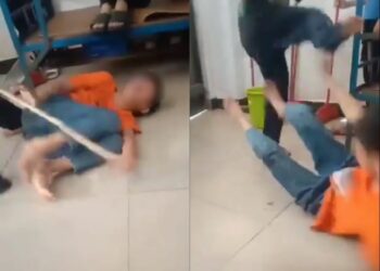 TANGKAP layar video memaparkan seorang kanak-kanak lelaki dipukul menggunakan kayu serta ditendang.
