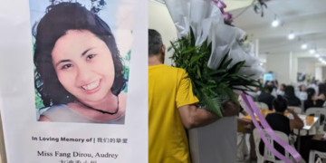 SEORANG lelaki membawa kalungan bunga di rumah pengebumian warga Singapura, Audrey Fang, yang terbunuh di Sepanyol. -CNA
