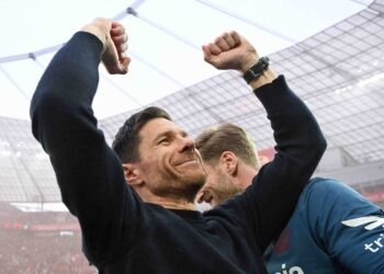 XABI Alonso meraikan kejayaan Bayer Leverkusen menjulang kejuaraan Bundesliga buat pertama kali dalam tempoh 120 tahun sejarah kelab itu. - AFP