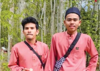 GAMBAR kenangan Muhammad Luqman Zuraidi (kiri) bersama adiknya ketika Hari Raya Aidilfitri baru-baru ini, di Baling.