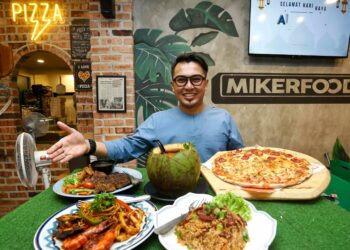 iAMZARI bersama pelbagai hidangan menarik yang terdapat di Restoran Miker Food miliknya.
