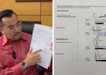 ASYRAF Wajdi Dusuki menunjukkan perjanjian ditandatangani Jailani Khamis.