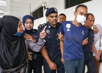 HAIRIL Anaas Abdullah dihadapkan di Mahkamah Majistret Batu Gajah hari ini atas pertuduhan membunuh hingga menyebabkan kematian isterinya di sebuah hotel di Batu Gajah dua minggu lalu. - UTUSAN/MUHAMAD NAZREEN SYAH MUSTHAFA