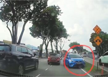 TANGKAP layar satu rakaman video yang tular menunjukkan sebuah Perodua Myvi berwarna biru (dalam bulatan merah) dipandu secara melawan arus di Jalan Masjid Negeri, George Town, Pulau Pinang.