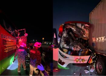 ANGGOTA bomba melakukan kerja-kerja menyelamat susulan nahas jalan raya membabitkan sebuah bas persiaran dengan treler di KM157.8 Lebuhraya Utara Selatan arah utara berhampiran Sungai Bakap, Nibong Tebal, Pulau Pinang, awal pagi tadi.-GAMBAR/JBPM PULAU PINANG