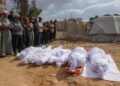 PENDUDUK Palestin melakukan solat jenazah terhadap ahli keluarga Abou Mahadi yang terkorban akibat bedilan udara tentera Israel di Beit Lahia di utara Semenanjung Gaza. – AFP