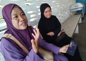 NOR Zaini Che Nor Allasahlila Puttera (kiri) pilu ketika ditemui pemberita di Jabatan Perubatan Forensik, Hospital Taiping, Perak hari ini.