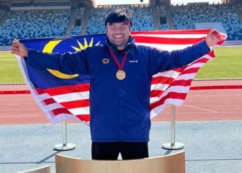 Muhammad Ziyad Zolkefli meraih pingat emas dalam acara lontar peluru F20 di Kejohanan Dunia Grand Prix Para Maghiribi, kelmarin. - IHSAN MSN