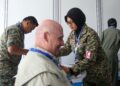 DR.  Siti Khadijah Abdul Hamid memeriksa juruterbang pasukan aerobatik Russian Knights ketika LIMA’25 di Langkawi. – UTUSAN/SHAHIR NOORDIN
