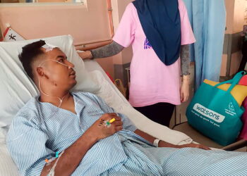 MOHD. Hanif Taufik Rodzi antara anggota Pasukan Simpanan Persekutuan (FRU) menerima rawatan di Hospital Teluk Intan, Perak.
