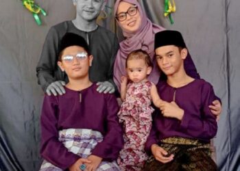 GAMBAR keluarga Norazian Mohd. Joned (kanan) dan suami Allahyarham Koperal Amiruddin Zabri serta anak-anak mereka. - UTUSAN