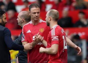 Christian Eriksen dan Jonny Evans antara pemain yang bakal dilepaskan oleh Manchester United.-AFP