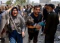 SEORANG lelaki mendukung kanak-kanak yang cedera dalam serangan Israel di kejiranan Saftawi, barat Jabalia, di Semenanjung Gaza.-AFP