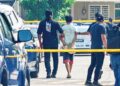 SUSPEK berusia 17 tahun dibawa keluar dari rumahnya oleh anggota polis selepas dipercayai membunuh dua ahli keluarganya di Taman Rambai Mutiara, Bukit Rambai, Melaka semalam.