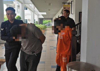 PASANGAN kekasih yang disyaki membawa dadah direman enam hari oleh Mahkamah Majistret, Ayer Keroh, Melaka. - UTUSAN/AMRAN ALI
