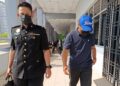 SAHZUL Hisam Samsuri (kanan) hadir ke  Mahkamah Sesyen Seremban hari ini nagi berdepan pertuduhan meminta rasuah sebanyak RM8,500  hampir tiga tahun lalu.-UTUSAN/NOR AINNA HAMZAH.