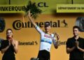 TIM Merlier (tengah) meraikan kejayaan di podium selepas memenangi peringkat ketiga perlumbaan berbasikal Tour de France di Dunkirk, Perancis, semalam. - AFP