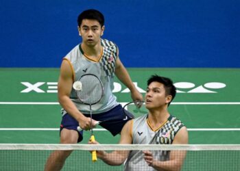 Goh Sze Fei-Nur Izzuddin Rumsani disaran memikirkan untuk kembali ke pangkuan Persatuan Badminton Malaysia (BAM) demi memulihkan semula prestasi kedua-duanya. - AFP