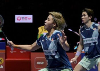 Chen Tang Jie-Toh Ee Wei berjaya menewaskan gandingan rumah, Gao Jia Xuan-wu Meng Ying dalam straight set 22-20, 21-17 dalam pusingan kedua Terbuka China, semalm. - AFP