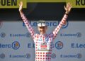 TADEJ Pogacar meraikan di atas podium dengan jersi polka dot selaku Raja Bukit selepas peringkat keempat perlumbaan berbasikal Tour de France dari Amiens Metropole ke Rouen, semalam. - AFP