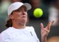 IGA Swiatek mengintai bola ketika menentang pemain Denmark, Clara Tauson aksi pusingan keempat pada hari kelapan Kejohanan Tenis Wimbledon 2025 di The All England Lawn Tennis and Croquet Club, semalam. - AFP
