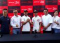 Pengurus Besar RCB, Marcus Leong (dua kiri) dan Pengarah Urusan ZK Racing, Zulfahmi Khairuddin (kiri) bergambar dengan dua pelumba muda sukan permotoran, Hakim Danish dan Qabil Irfan pada program RCB anjur bersama bakat muda permotoran Hakim Danish dan Qabil Irfan di Putrajaya di sini, hari ini