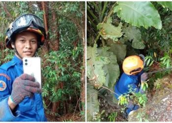 ANGGOTA APM Jelebu melakukan khidmat khas mengambil sebuah telefon bimbit milik seorang wanita yang terjatuh di curam bukit di Bukit Batu Sawa, Jelebu, 12 Julai lalu.-GAMBAR/IHSAN APM