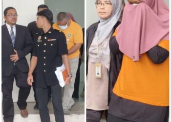 SUSPEK dibawa masuk ke mahkamah bagi mendapatkan perintah reman berhubung kes meminta dan menerima rasuah bernilai kira-kira RM70,000 di Kompleks Mahkamah Kangar, Perlis, hari ini. -UTUSAN/ASYRAF MUHAMMAD
