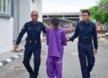 AZRIE Yazid (tengah) dibawa keluar dari Mahkamah Majistret Besut, Terengganu. -UTUSAN/PUQTRA HAIRRY