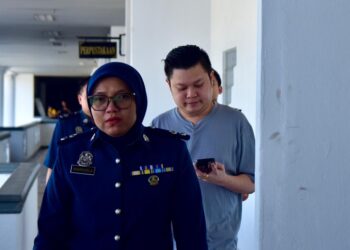 NG Wen Hua selaku OKC mengaku bersalah gagal membayar cukai perkhidmatan di Mahkamah Sesyen, Ayer Keroh, Melaka. - UTUSAN/ARIF HAMIZAN MISKON