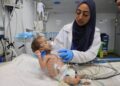 JURURAWAT Palestin merawat seorang bayi yang mengalami kekurangan zat makanan di Hospital Nasser di Khan Younis, selatan Gaza.- AFP