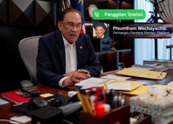 ANWAR Ibrahim mengadakan perbincangan menerusi panggilan telefon bersama Phumtham Wechayachai.-FB ANWAR IBRAHIM