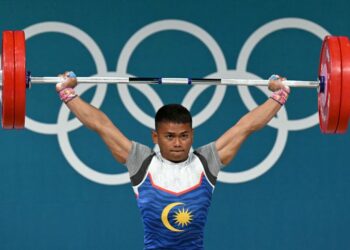 Mohamad Aniq Kasdan akan mendapatkan nasihat perubatan terlebih dahulu berhubung pemulihan kecederaannya sebelum menyertai kategori 60 kilogram di India. - AFP
