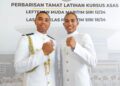 MUHAMMAD Aswad Abdul Shukor (kanan) dan Muhammad Adam  selepas Majlis Perbarisan Tamat Latihan Kursus Asas Maritim di Akademi Maritim Sultan Ahmad Shah (AMSAS) di Kuantan, Pahang, semalam.