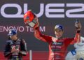 Marc Marquez meraikan kemenangan selepas perlumbaan MotoGP Hungary di litar Balaton Park di Balatonfokajar, semalam. - AFP